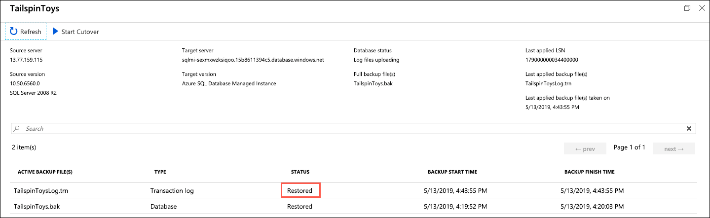 A status of Restored is highlighted next to the TailspinToysLog.trn file in the list of active backup files.